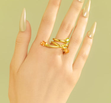 Bague asymétrique en or ornée de cristaux d’opale et de topaze