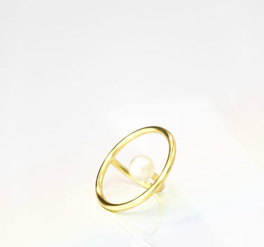 Bague circulaire en or et perle