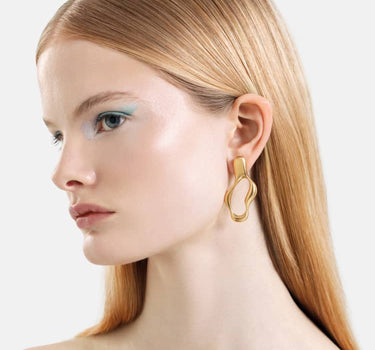 boucles d’oreilles créoles liquides en or